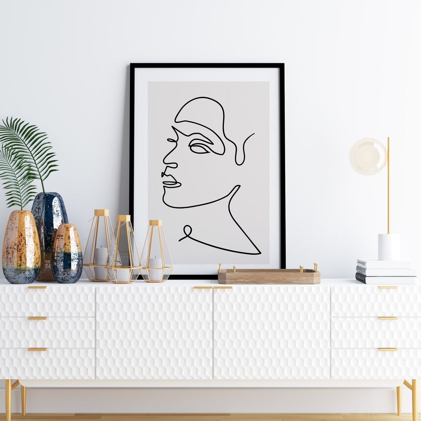 Minimalist wall art featuring a line art face