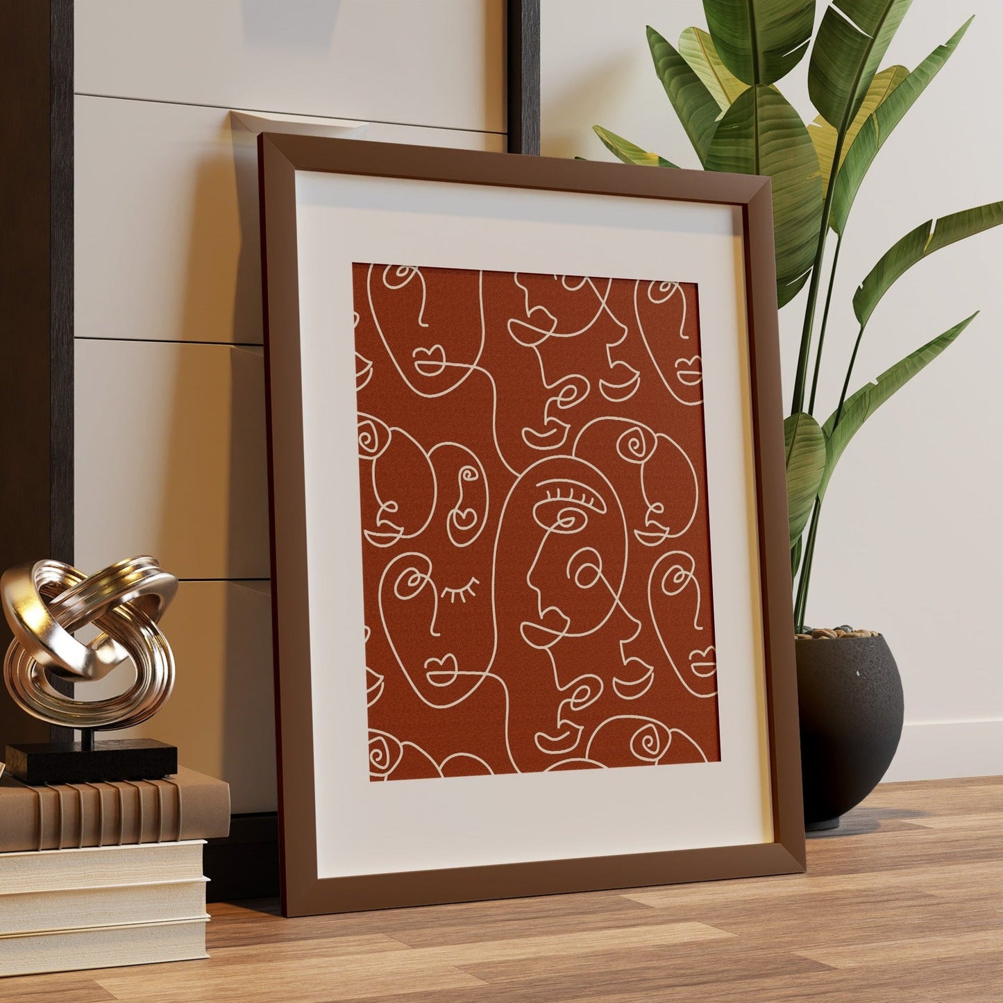 A framed art print featuring line art on a terracotta background