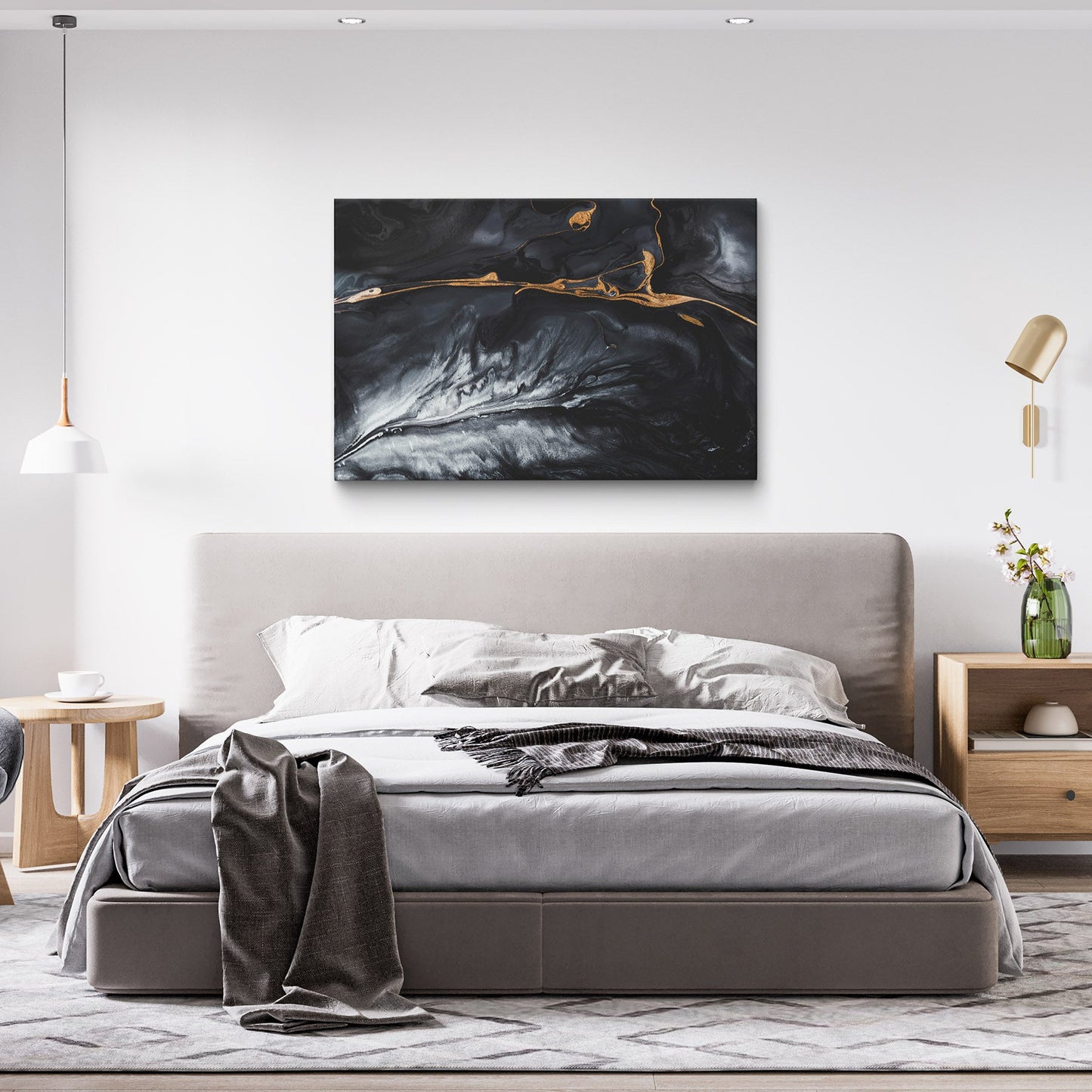 Abstract black and gold fluid art on canvas hung in a bedroom
