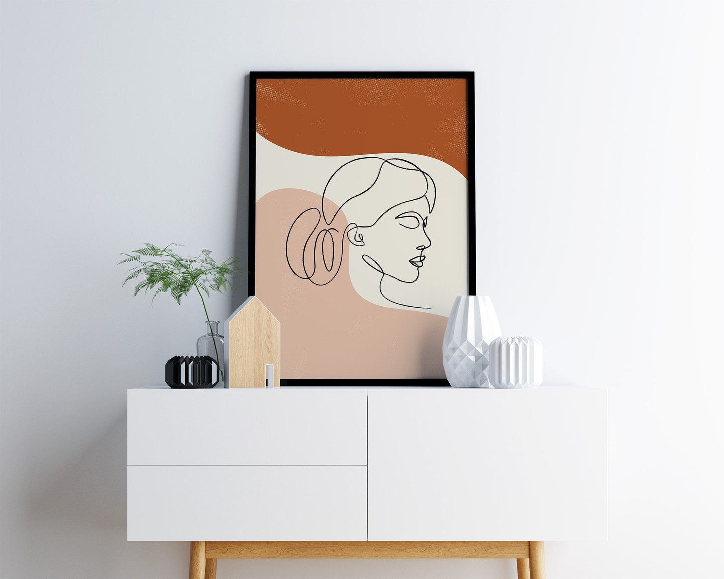 Line art face on an orange and terracotta background