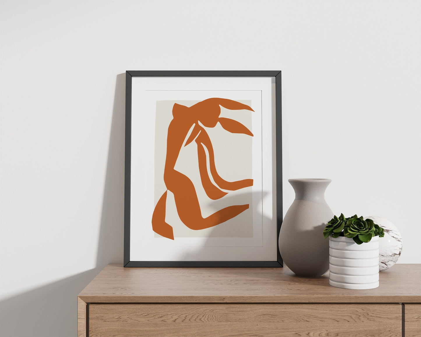 Orange print featuring nude woman figure