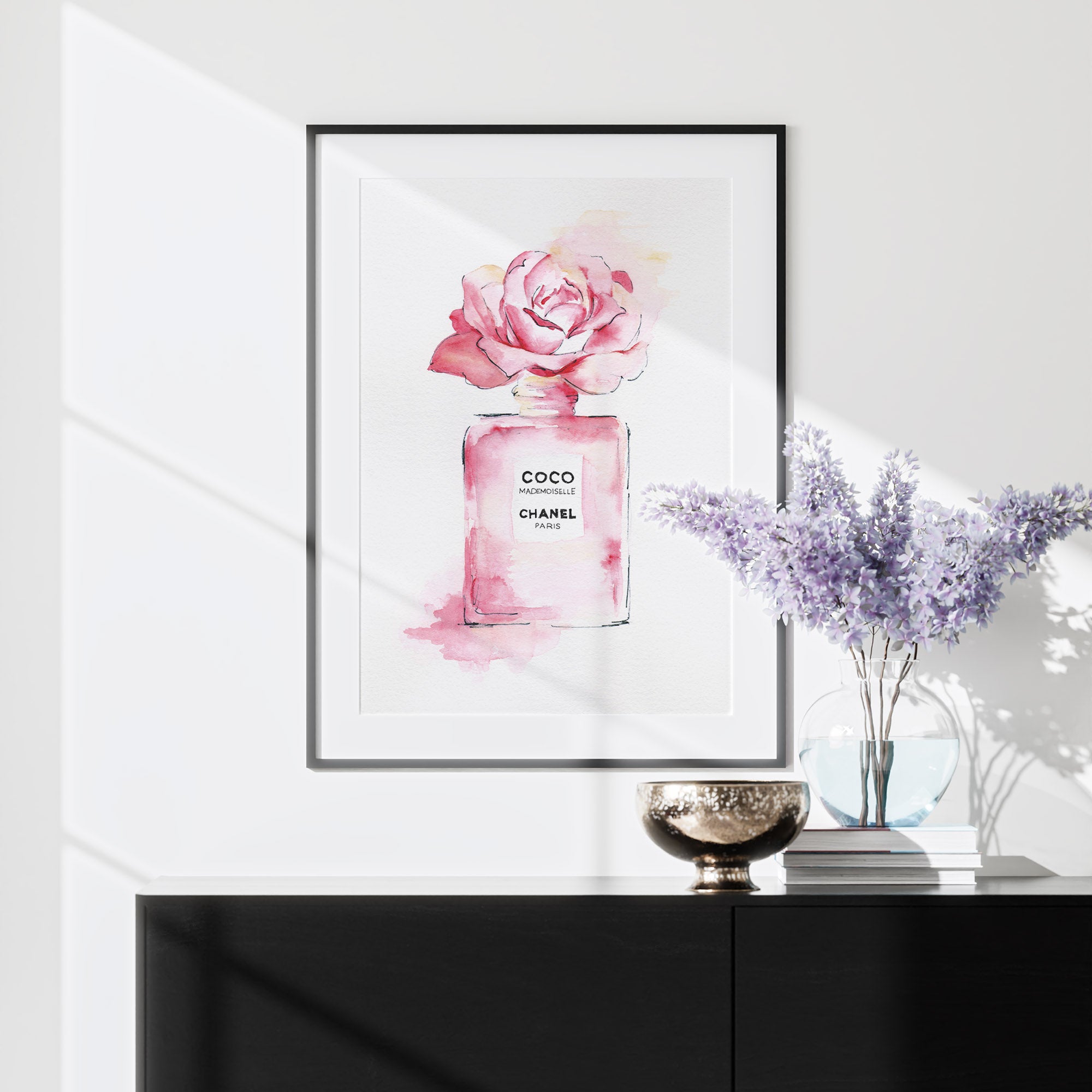 Chanel wall art featuring a Coco Mademoiselle perfume bottle