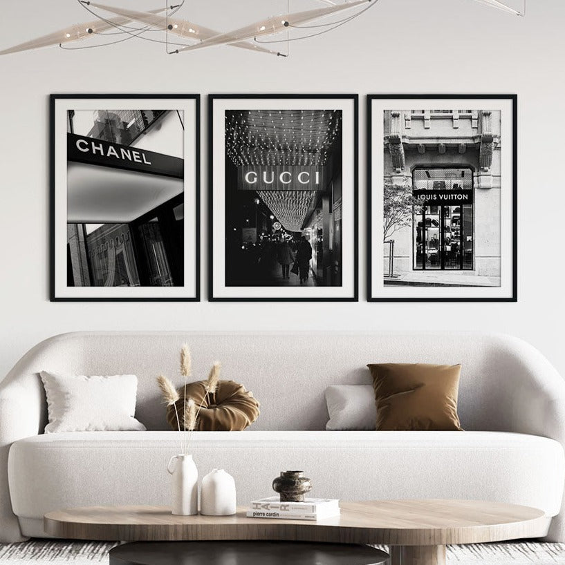 A set of 3 black and white prints featuring designer fashion houses