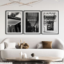 Load image into Gallery viewer, A set of 3 black and white prints featuring designer fashion houses
