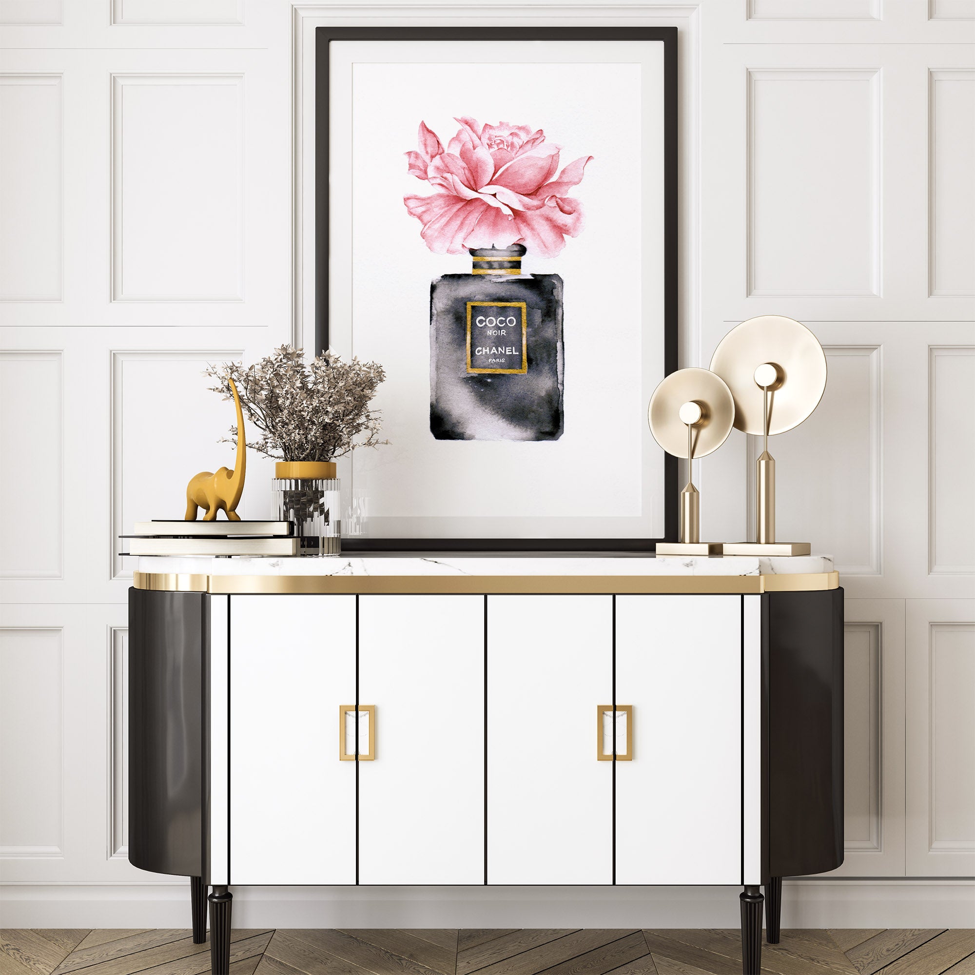 Sideboard styling with gold lamps and Coco Chanel watercolor print in black, gold and pink