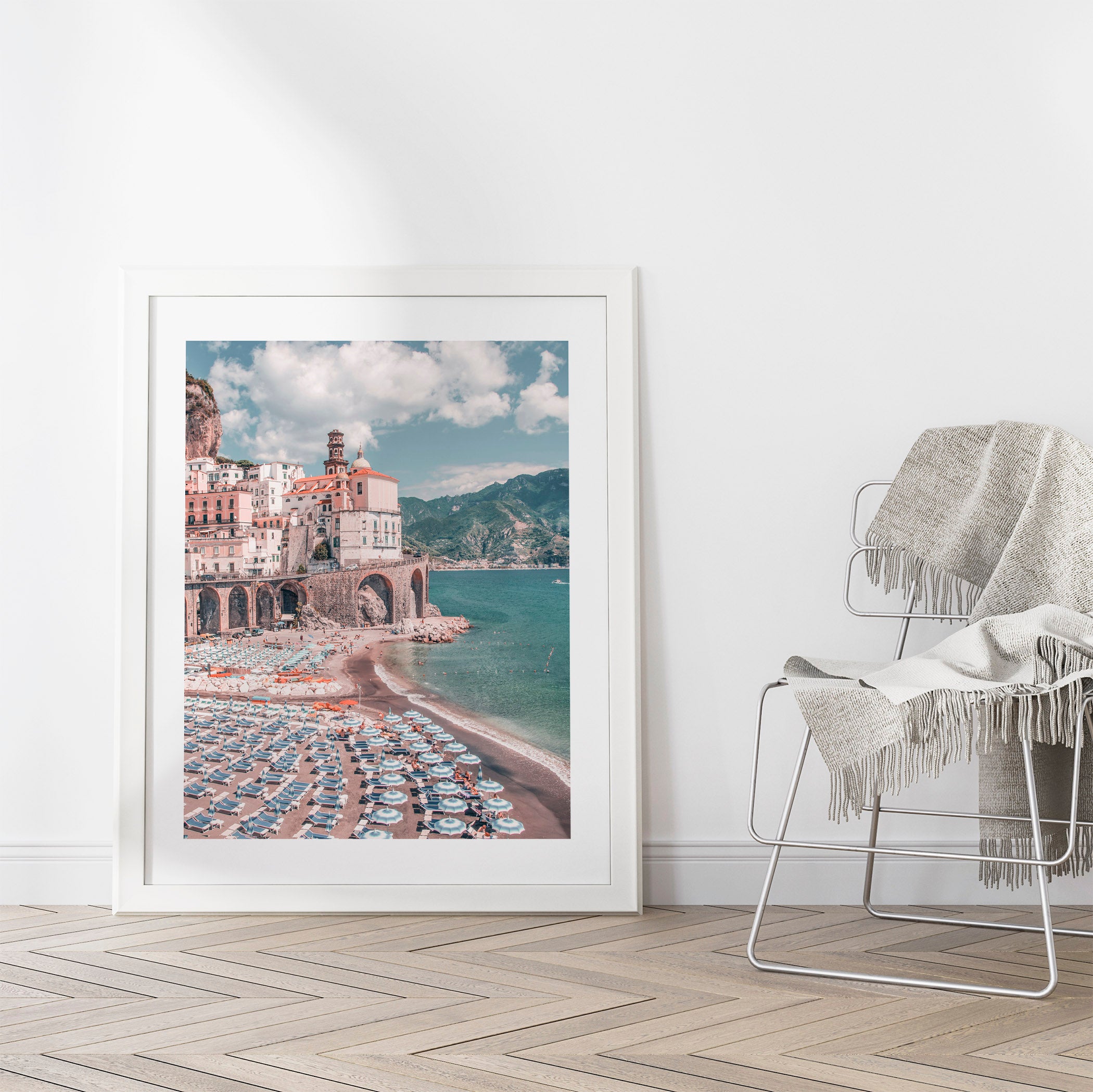 Coastal interior design featuring an Amalfi Coast photography print