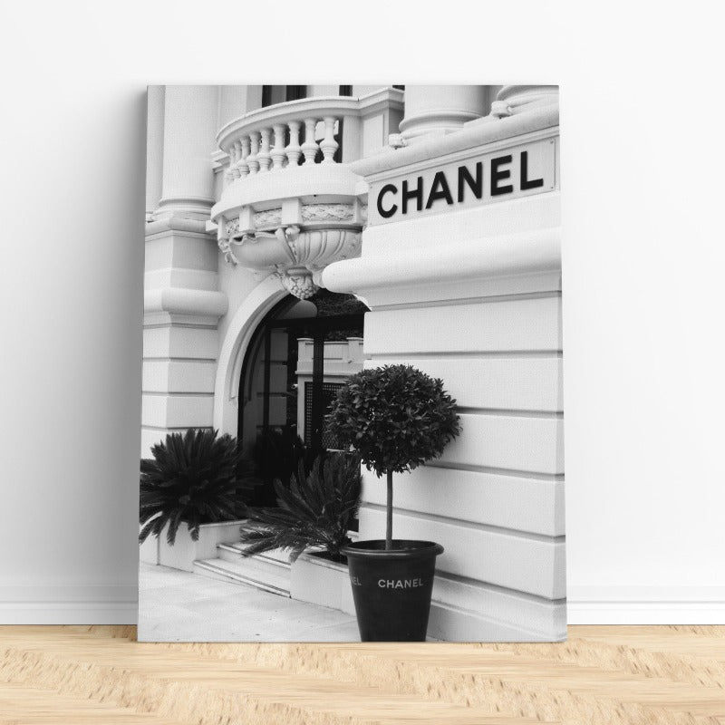 Designer wall art featuring a Chanel store in black and white