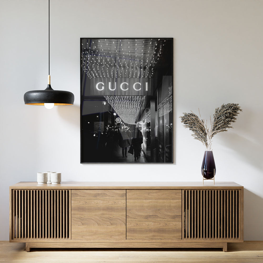 Sideboard interior decoration with a framed Gucci print