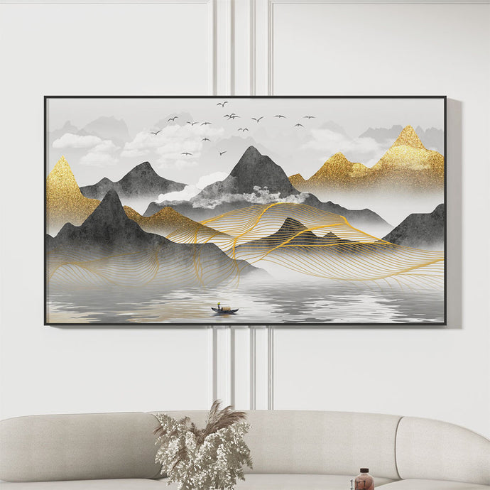 Large wall art featuring golden mountains and a lake