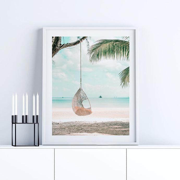 Coastal wall art featuring photography of a swing by the seaside